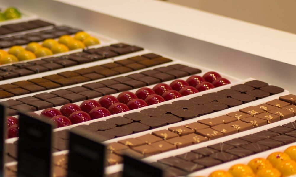 A display of luxury chocolate in a store crafted through the use of a well-engineered chocolate depositor